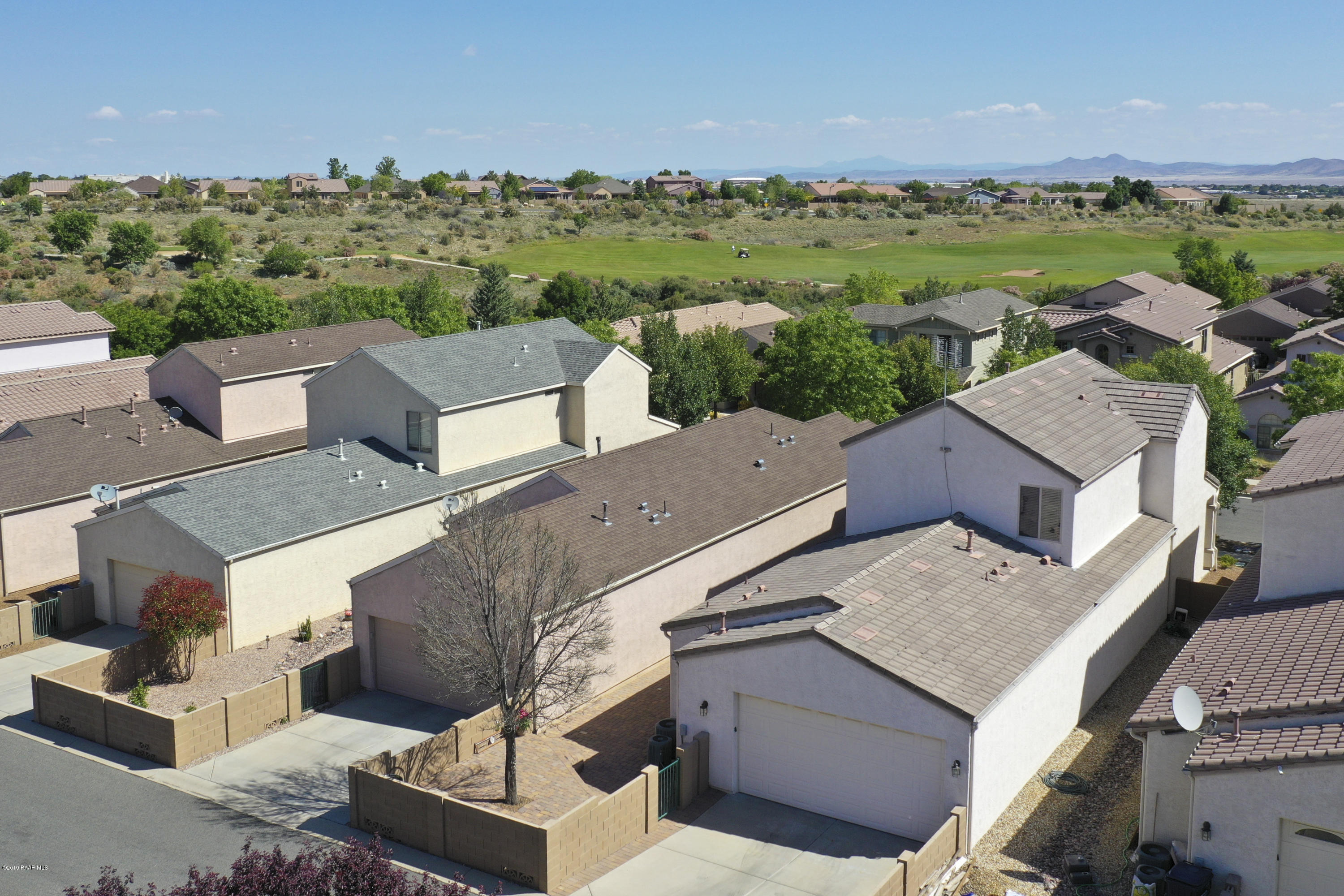 7257 Woolsey Ranch Road Prescott Valley, AZ 86314 - Photo 23 of 31 an aerial view of a house with a yard fire pit and outdoor seating