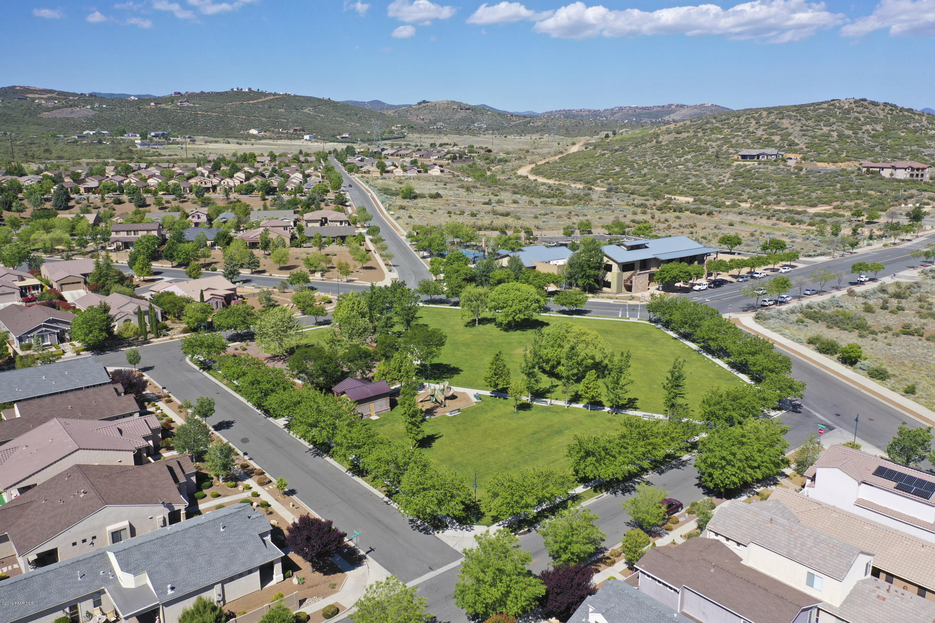 7257 Woolsey Ranch Road Prescott Valley, AZ 86314 - Photo 26 of 31 an aerial view of residential houses with outdoor space and trees