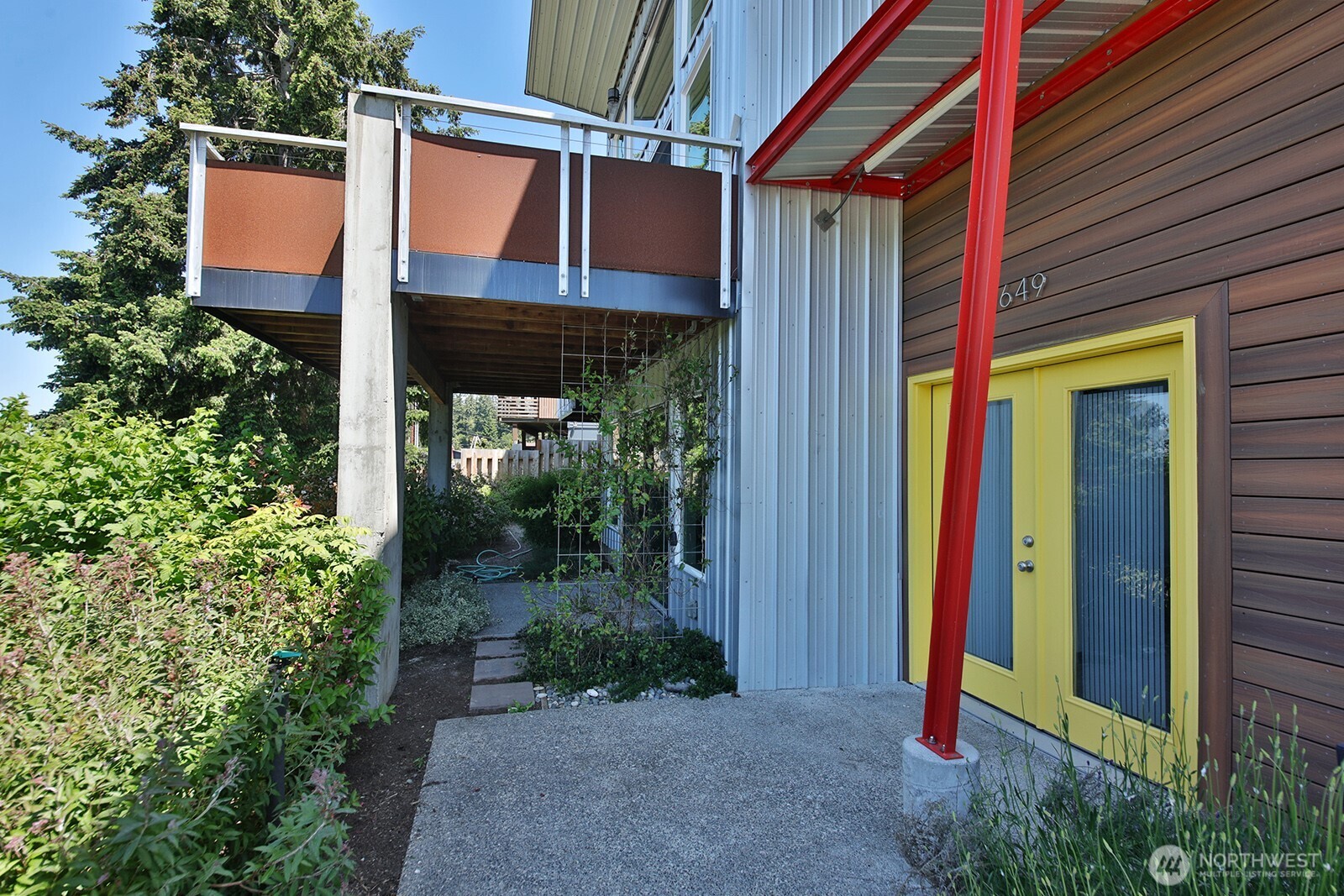 1649 Stewart Road Freeland, WA 98249 - Photo 11 of 40 a view of a house with a small porch and furniture