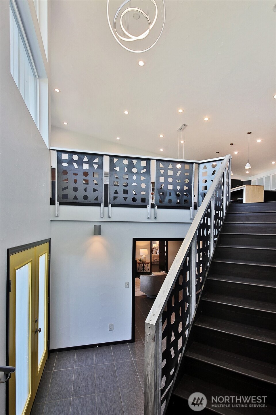 1649 Stewart Road Freeland, WA 98249 - Photo 13 of 40 a view of a hallway with wooden floor and staircase