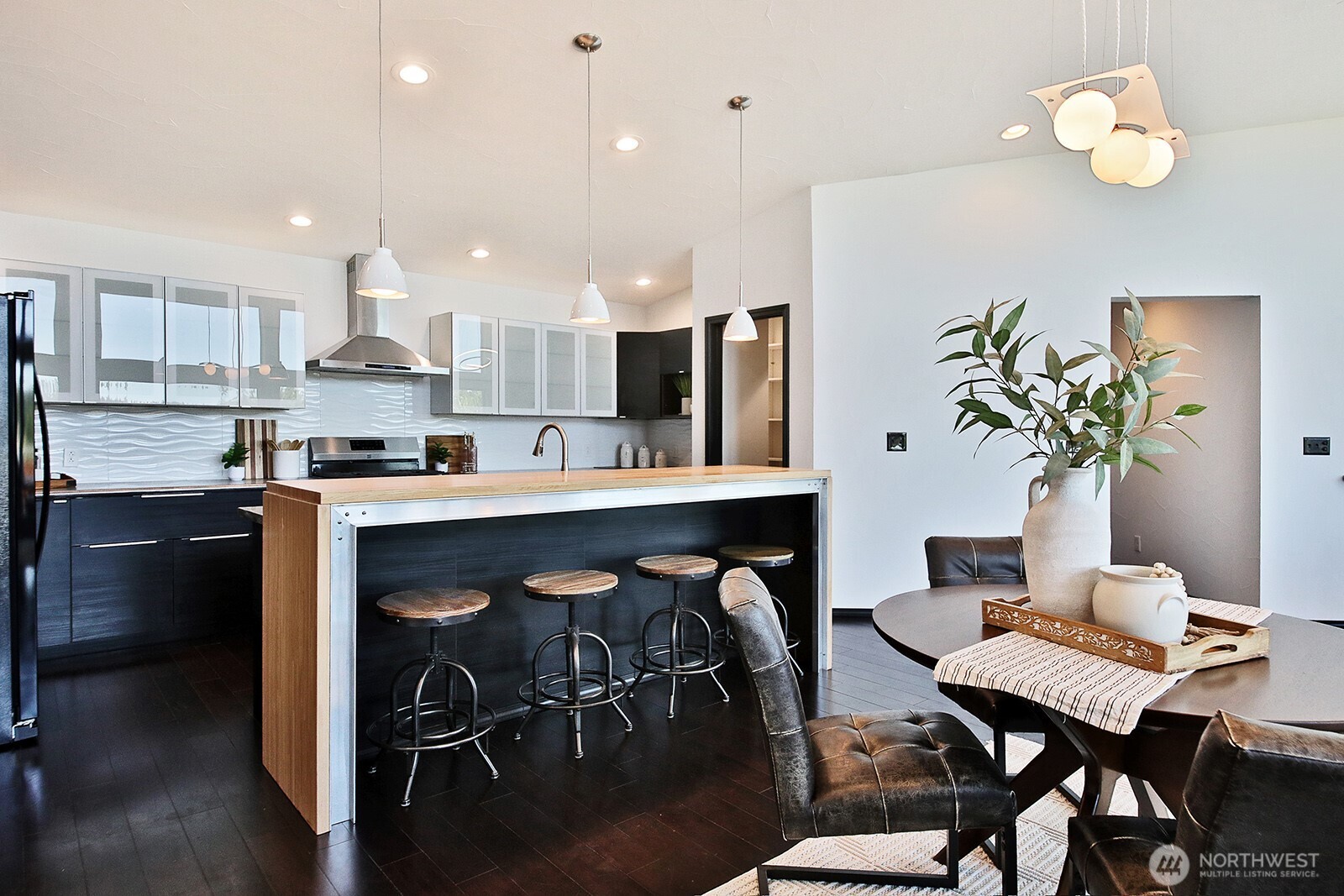 1649 Stewart Road Freeland, WA 98249 - Photo 21 of 40 a kitchen with a table and chairs in it