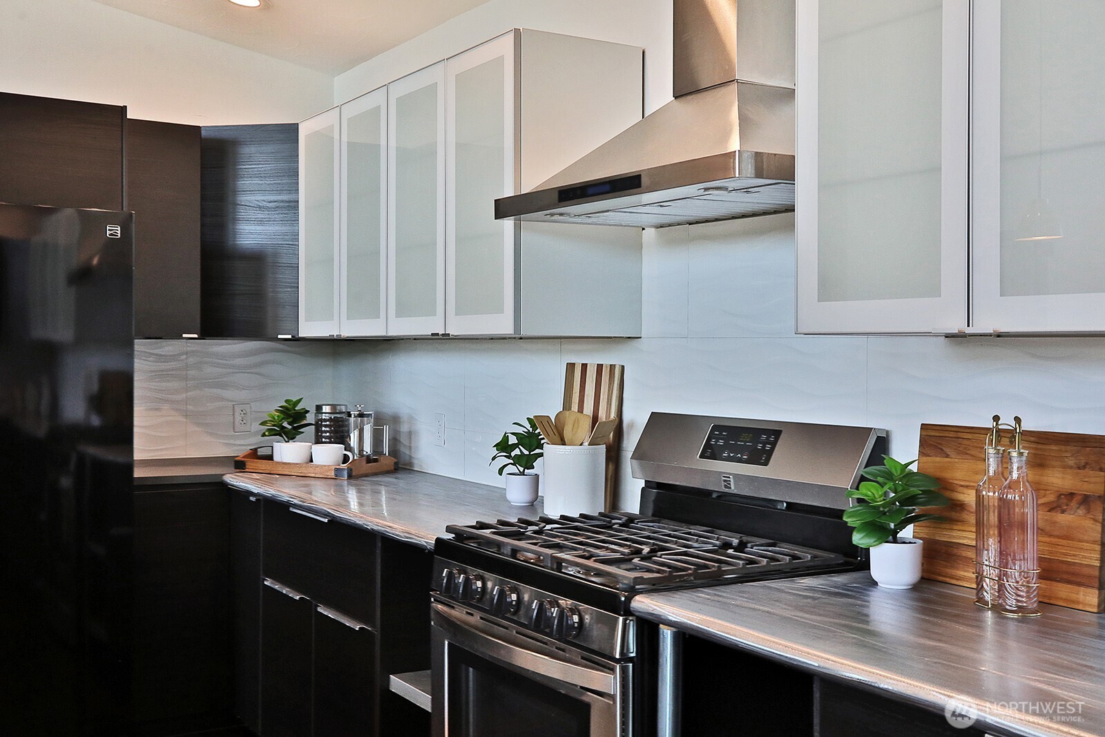 1649 Stewart Road Freeland, WA 98249 - Photo 23 of 40 a kitchen with stainless steel appliances a stove a sink a refrigerator and cabinets