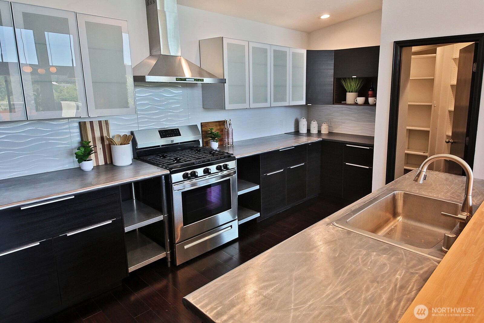 1649 Stewart Road Freeland, WA 98249 - Photo 24 of 40 a kitchen with granite countertop a stove and a sink