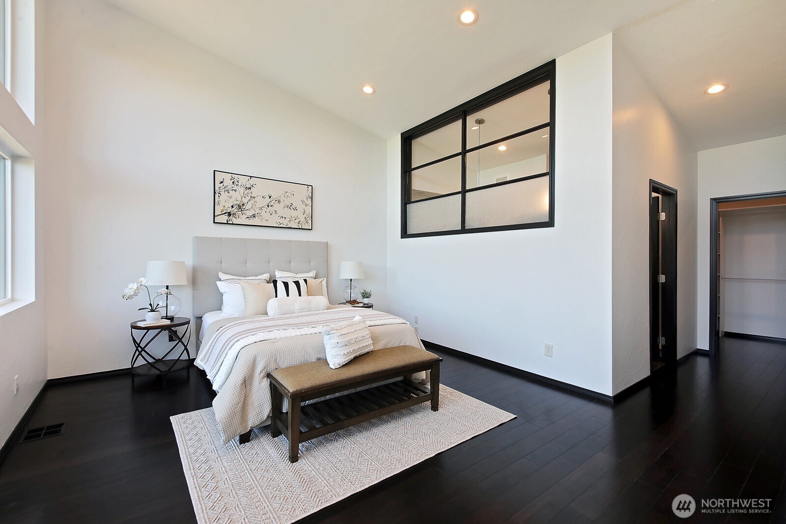 1649 Stewart Road Freeland, WA 98249 - Photo 26 of 40 a bedroom with a bed and a night stand