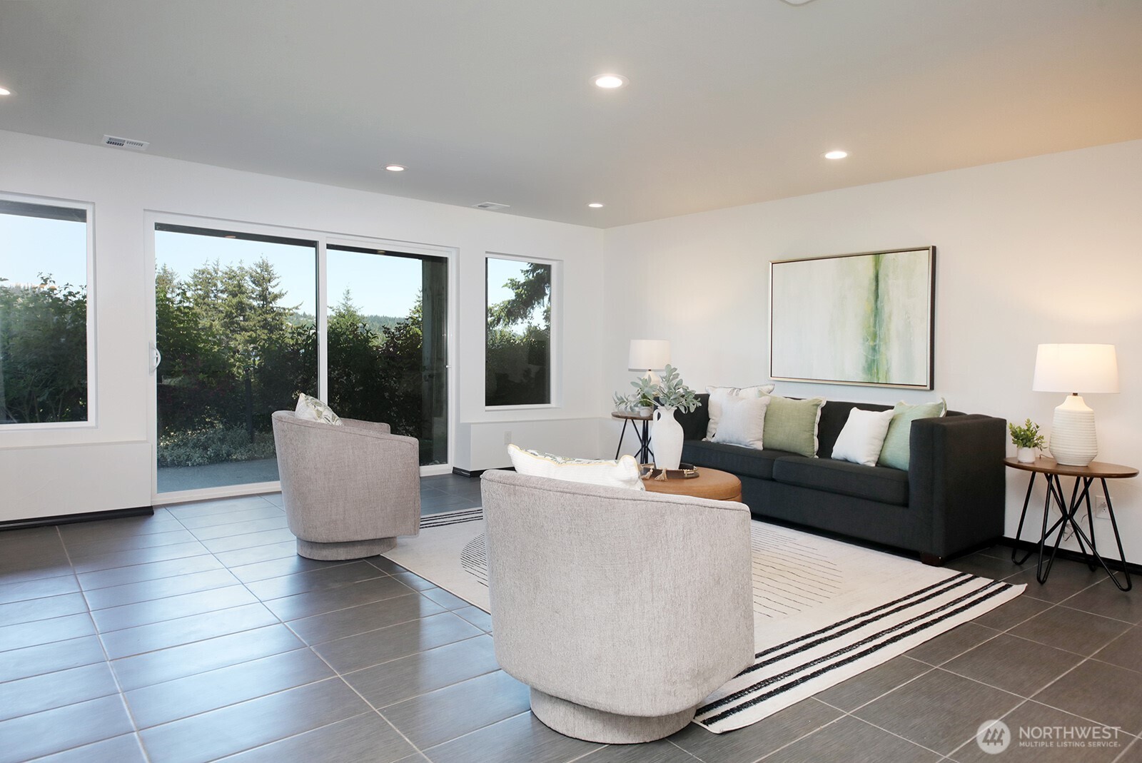 1649 Stewart Road Freeland, WA 98249 - Photo 35 of 40 a living room with couches and a coffee table with garden view