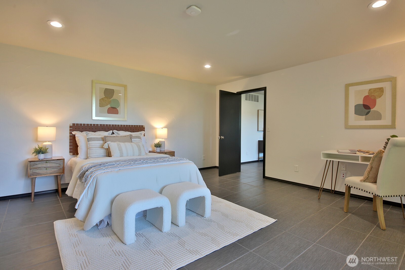 1649 Stewart Road Freeland, WA 98249 - Photo 36 of 40 a bedroom with a bed and lamp