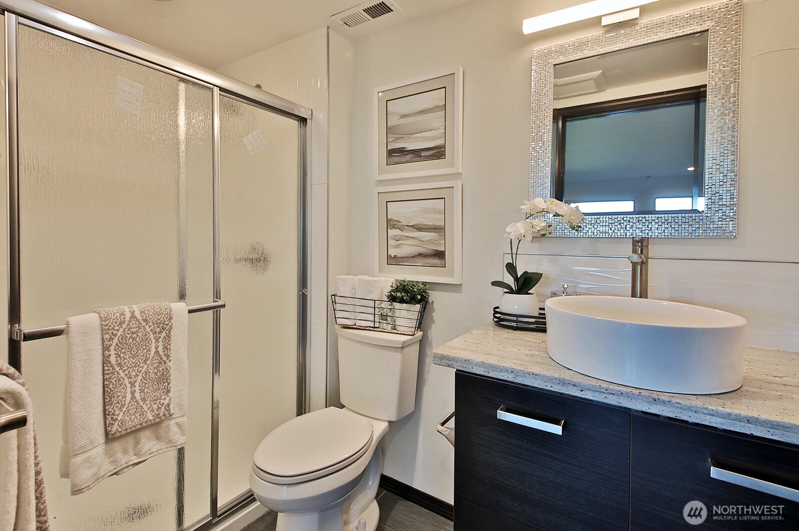 1649 Stewart Road Freeland, WA 98249 - Photo 37 of 40 a bathroom with a toilet a sink and a mirror