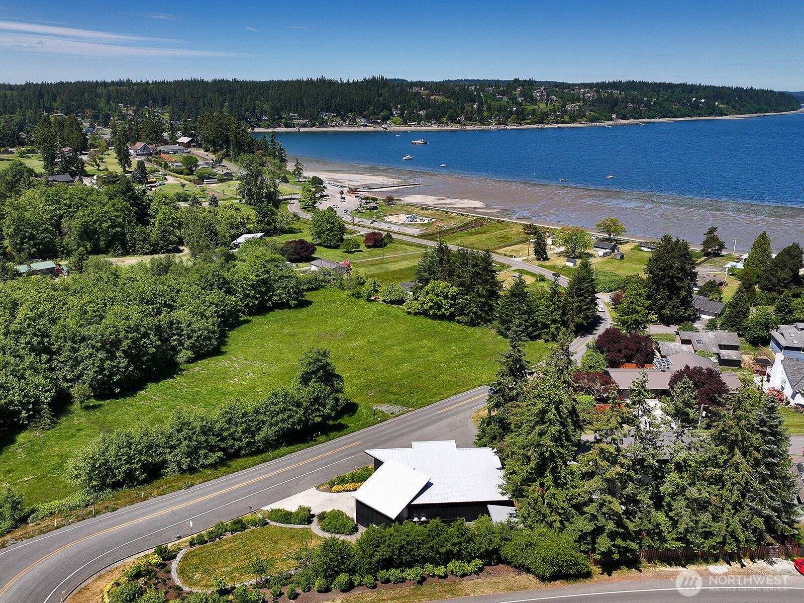 1649 Stewart Road Freeland, WA 98249 - Photo 4 of 40 an aerial view of a house with a garden and lake view