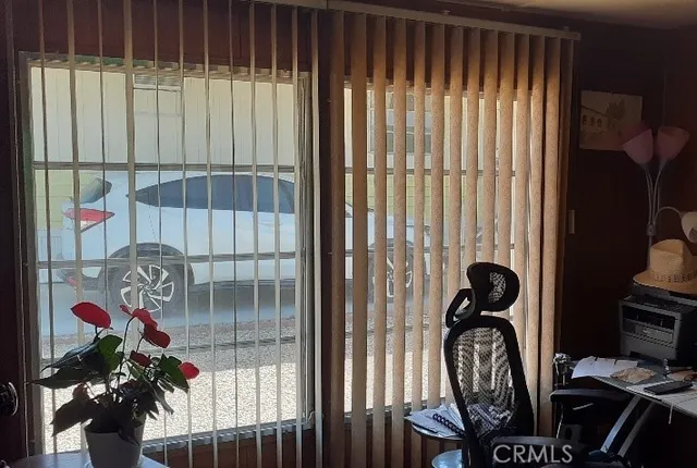 en empty room with wooden floor