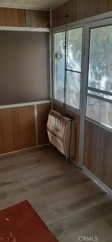 a view of a house with swimming pool and sitting area