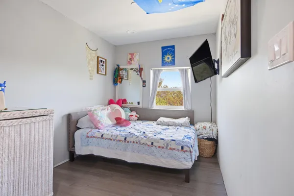 a view of a porch with potted plants