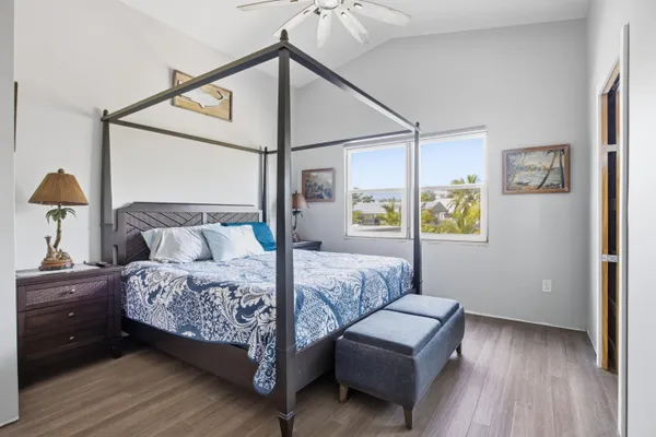 an aerial view of a house with a yard and garden