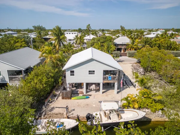 a kitchen with stainless steel appliances granite countertop a stove sink and cabinets