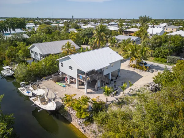 a bedroom with furniture and a flat screen tv