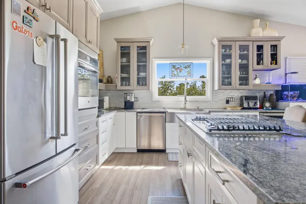 a view of a room with wooden floor and roof