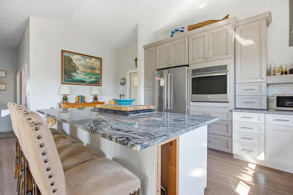 an aerial view of a house with yard swimming pool and outdoor seating