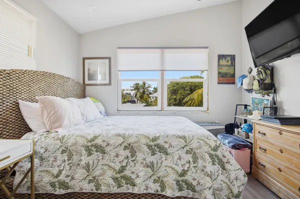 a bathroom with a sink a toilet and a shower