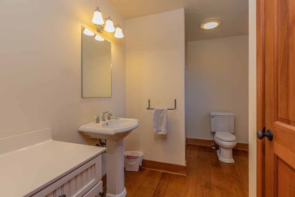 110 Whitney Road Phillipston, MA 01331 - Photo 10 of 26 a bathroom with a sink a toilet and a mirror