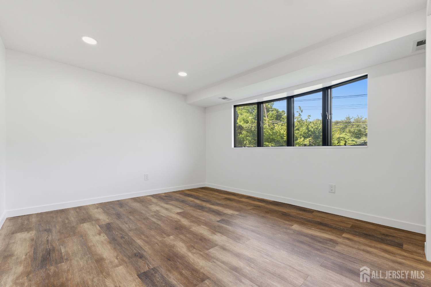 12 Daniel Road Spotswood, NJ 08884 - Photo 14 of 27 wooden floor in an empty room