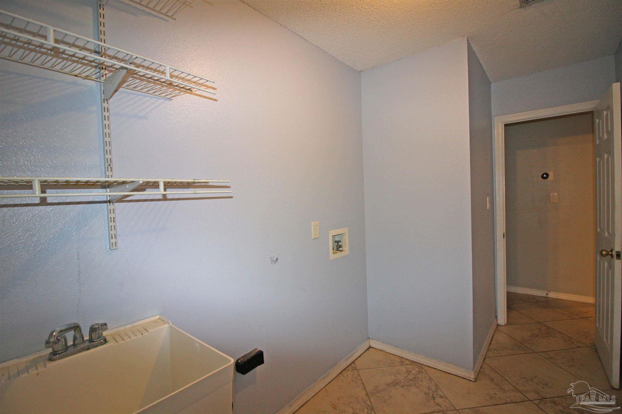 3735 Berrypatch Lane Pace, FL 32571 - Photo 25 of 46 a bathroom with a sink and shower