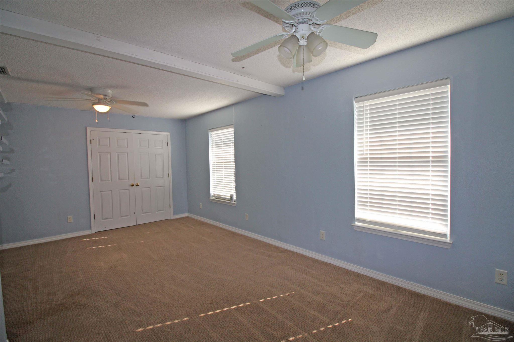3735 Berrypatch Lane Pace, FL 32571 - Photo 32 of 46 a view of an empty room with a window
