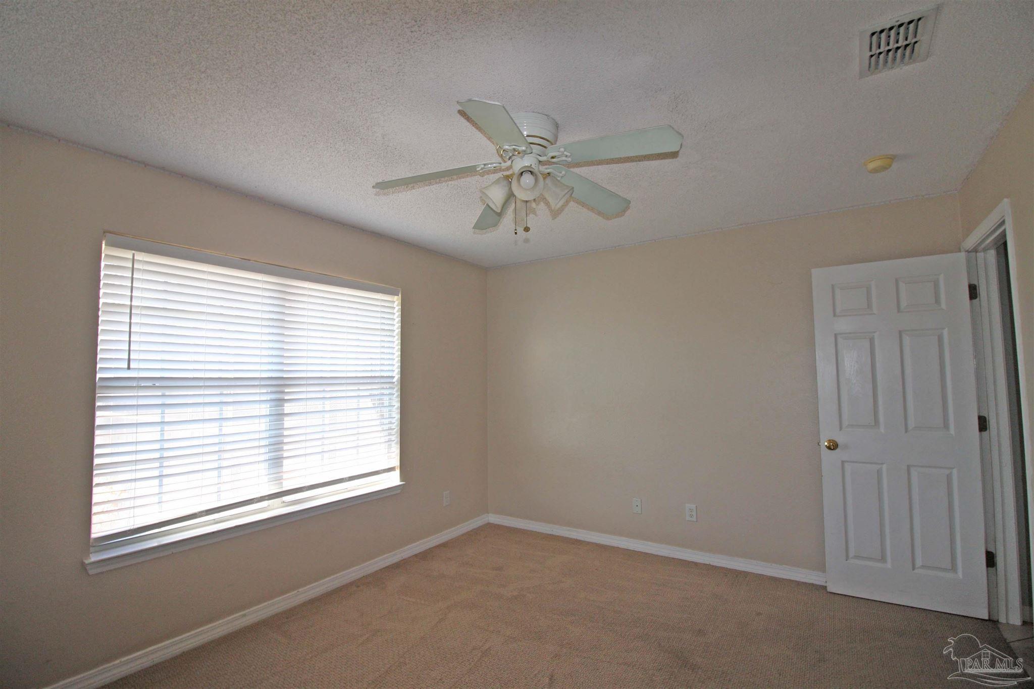 3735 Berrypatch Lane Pace, FL 32571 - Photo 33 of 46 a view of an empty room with a window