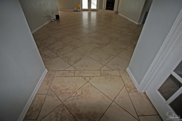 a view of an empty room with a window