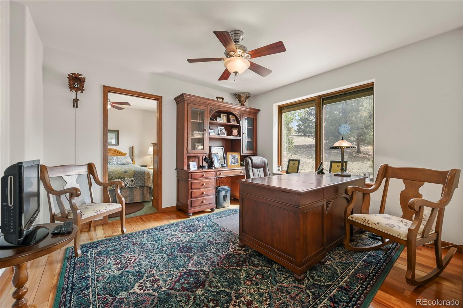 322 Sequoia Road Hartsel, CO 80449 - Photo 21 of 50 a living room with furniture and a large window
