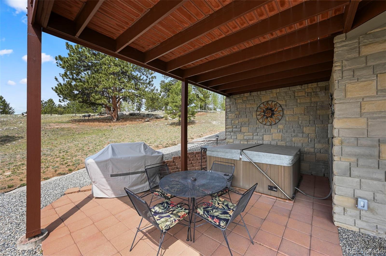 322 Sequoia Road Hartsel, CO 80449 - Photo 32 of 50 a patio with a table and chairs