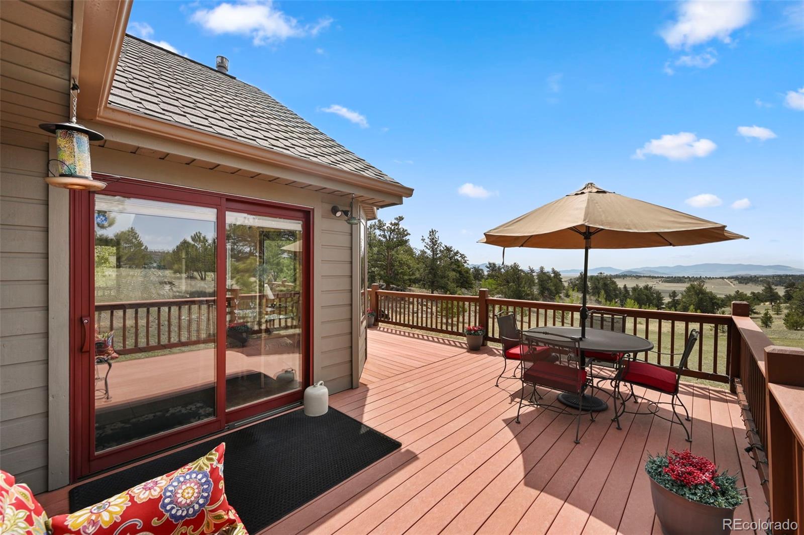 322 Sequoia Road Hartsel, CO 80449 - Photo 35 of 50 a view of balcony with wooden floor and outdoor seating