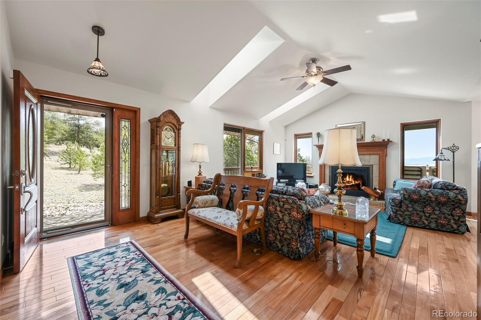 322 Sequoia Road Hartsel, CO 80449 - Photo 5 of 50 a living room with furniture and wooden floor