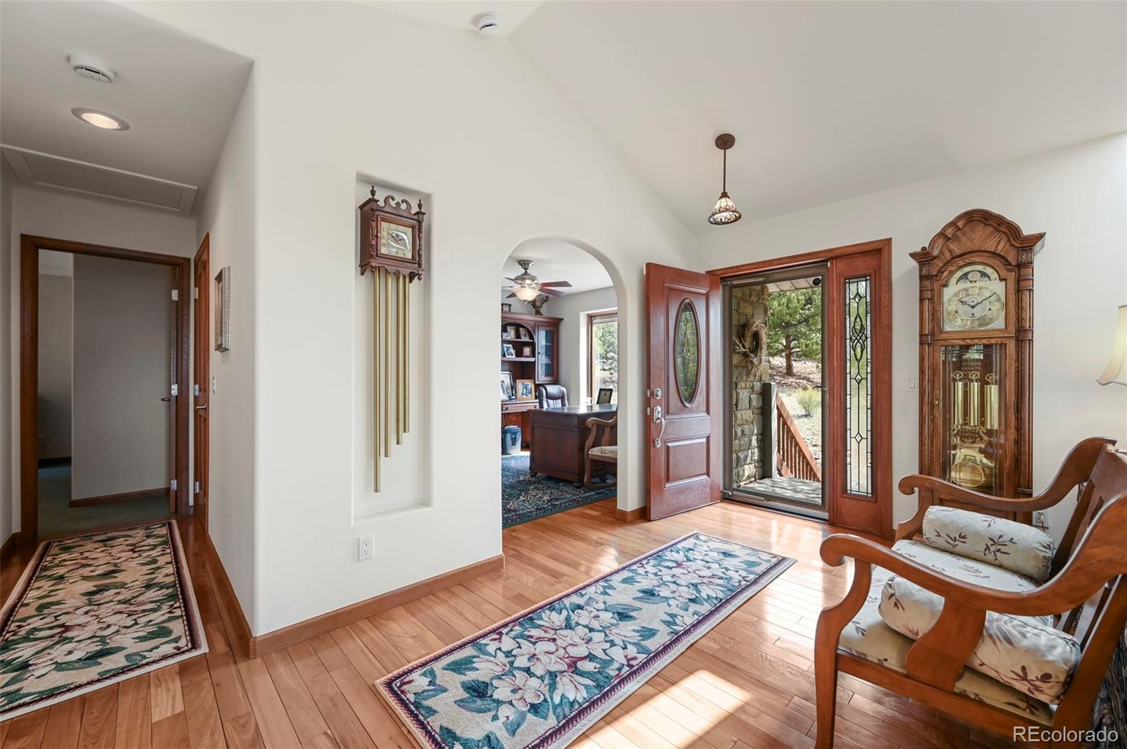322 Sequoia Road Hartsel, CO 80449 - Photo 6 of 50 a view of a hallway with wooden floor and windows