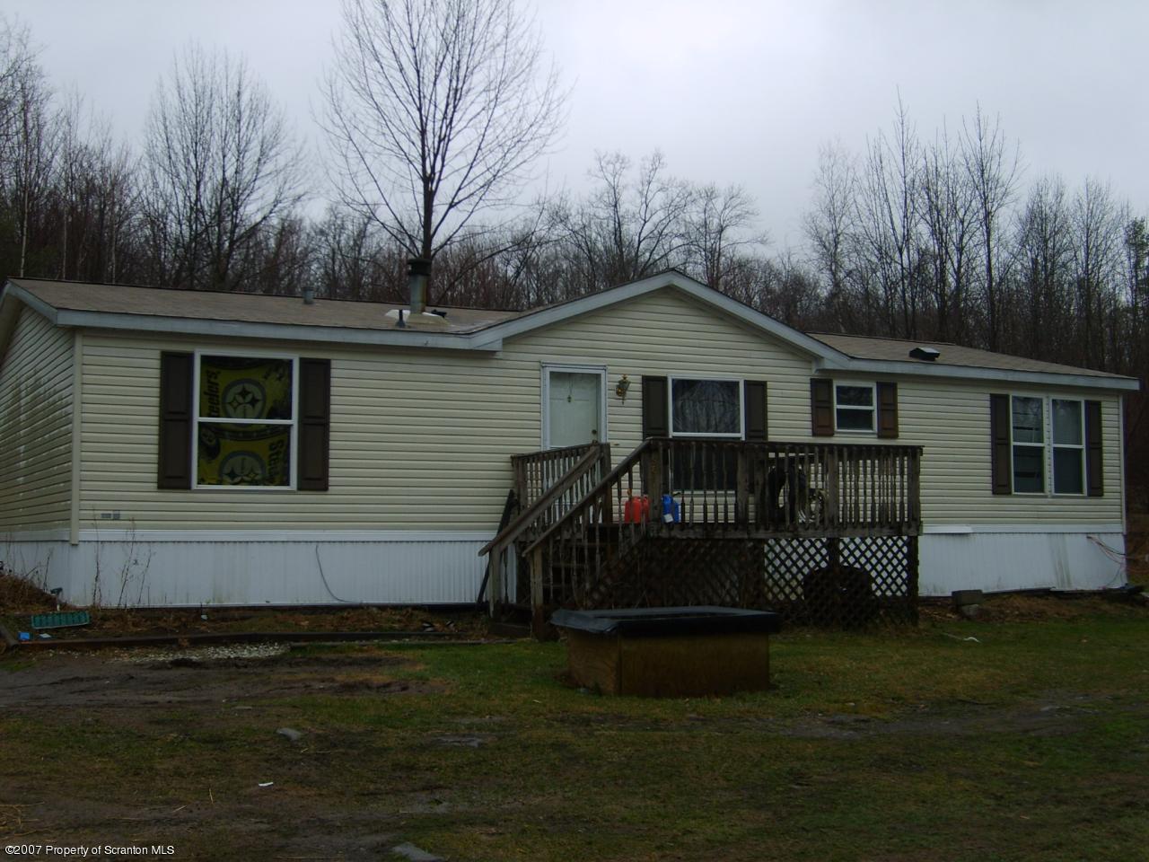 981 Cortez Road Lake Ariel, PA 18436 - Photo 1 of 1 a front view of a house with a garden