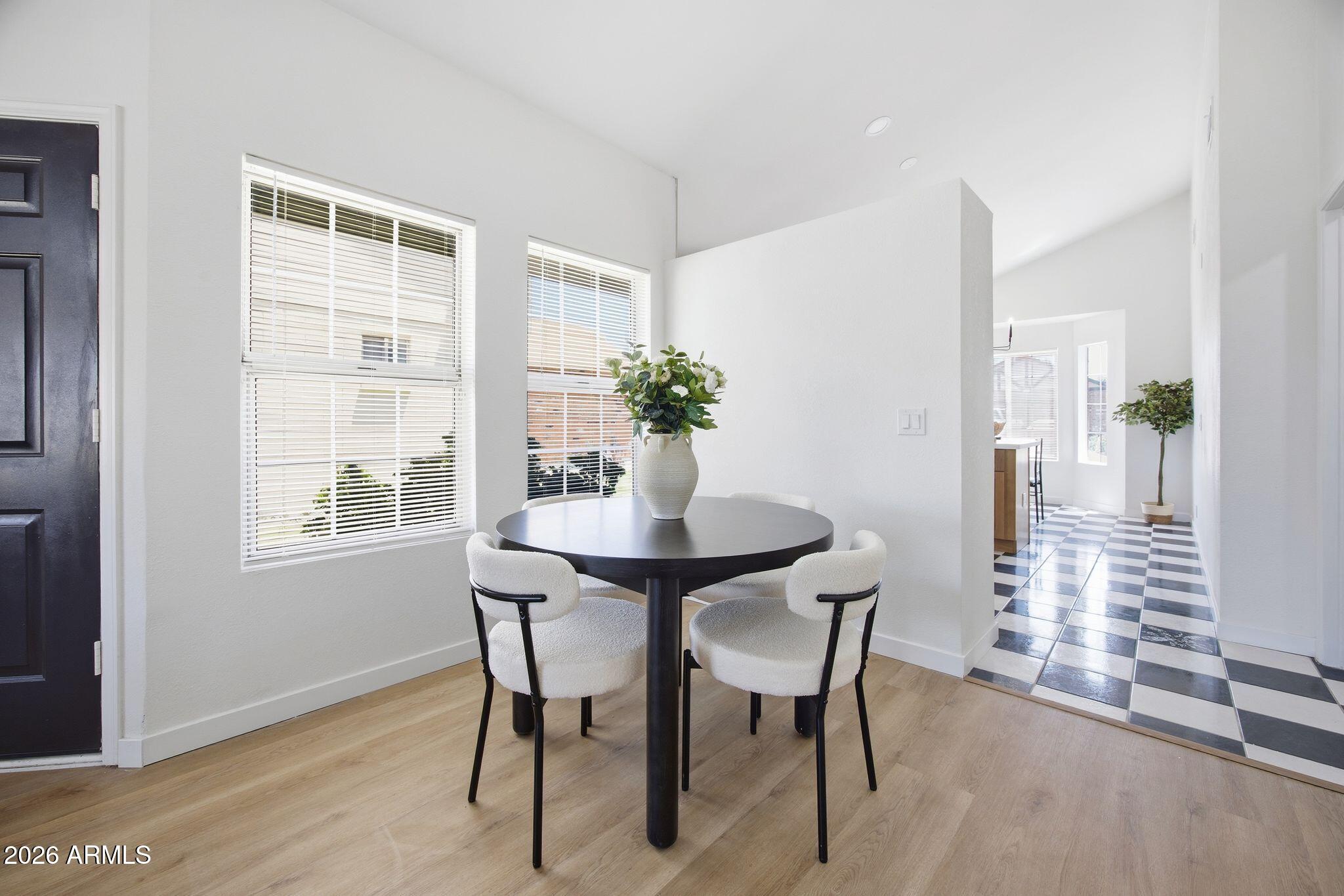 3134 East McKellips Road, Unit 69 Mesa, AZ 85213 - Photo 6 of 24 a dining room with furniture and window