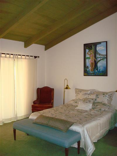 410 Church Road, Unit 39 Ojai, CA 93023 - Photo 16 of 25 Master bedroom with vaulted ceiling and back patio access.