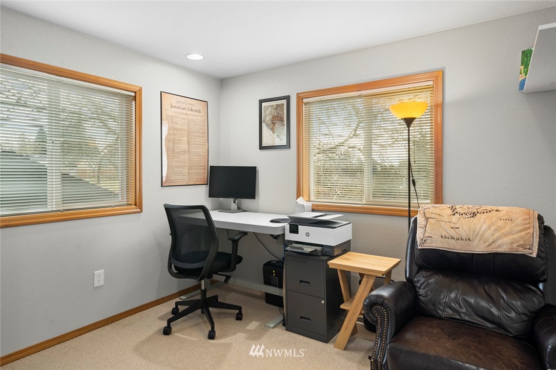 2202 179th Street Southeast Bothell, WA 98012 - Photo 15 of 31 a view of a workspace with furniture and a window