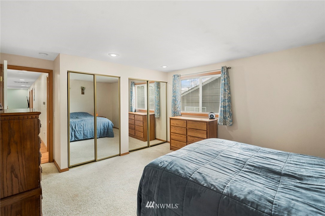 2202 179th Street Southeast Bothell, WA 98012 - Photo 17 of 31 a bedroom with a bed and a view of kitchen
