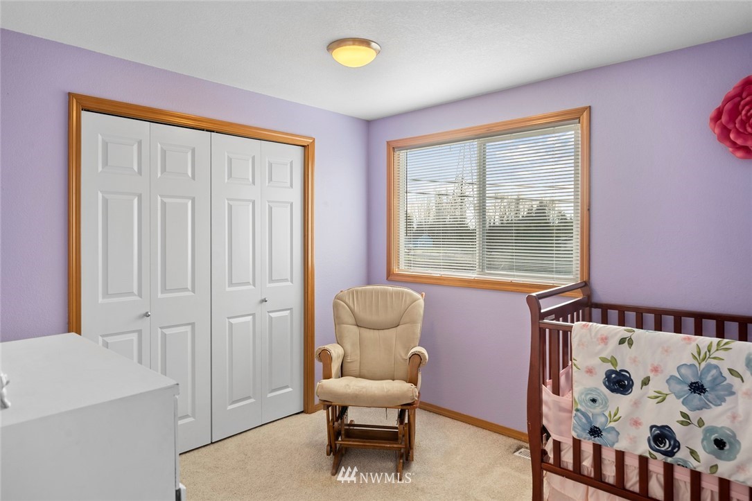 2202 179th Street Southeast Bothell, WA 98012 - Photo 20 of 31 a living room with furniture and a window