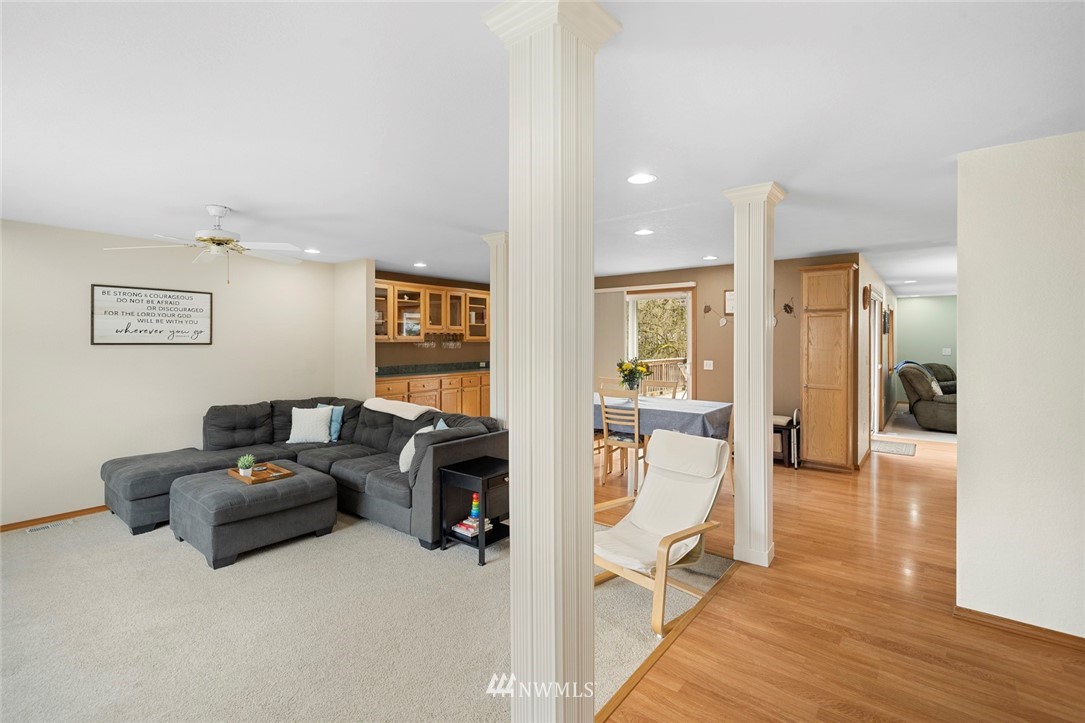 2202 179th Street Southeast Bothell, WA 98012 - Photo 3 of 31 a living room with furniture and a wooden floor