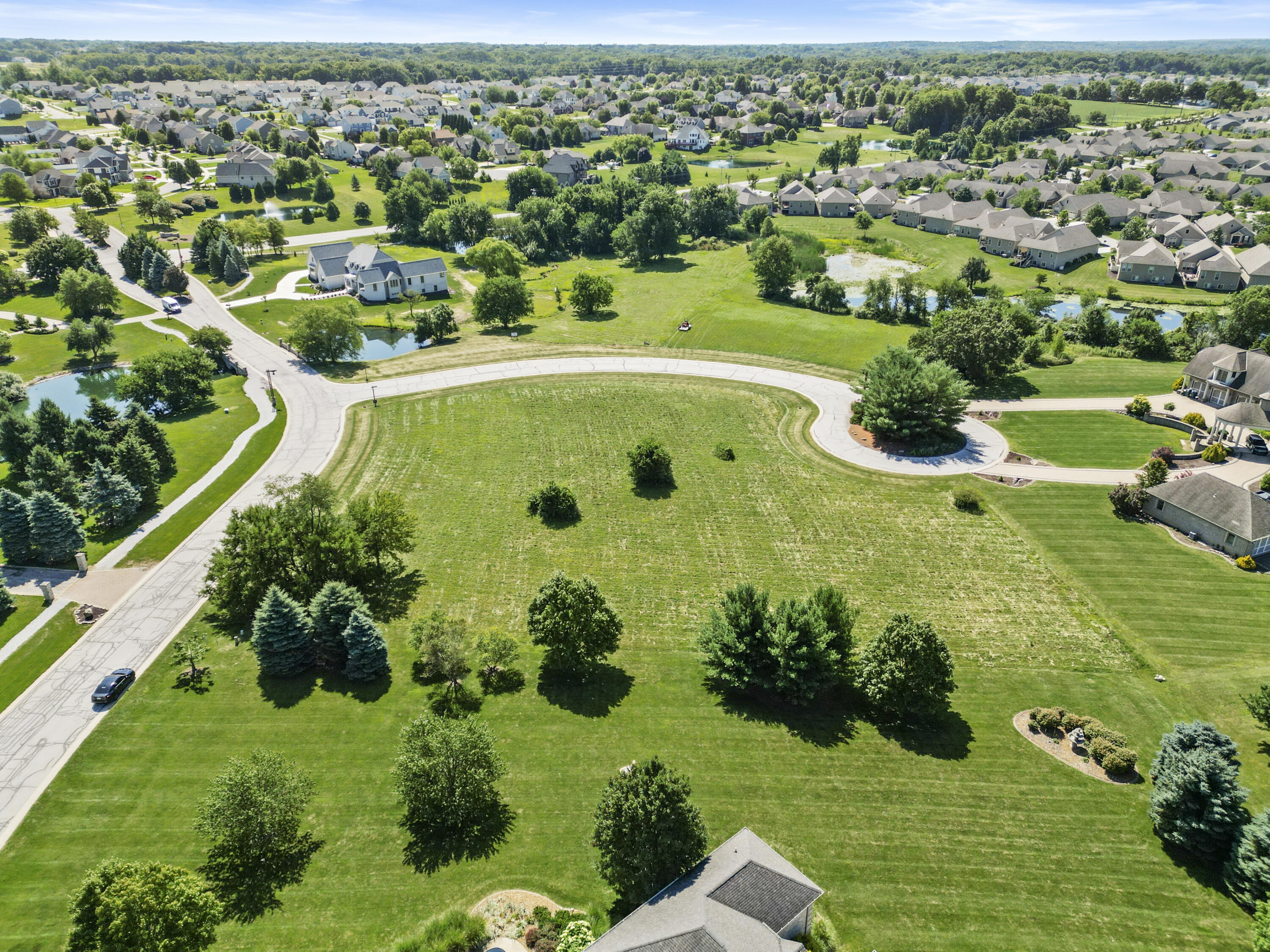 2960 Spring Rain Court Valparaiso, IN 46385 - Photo 2 of 14 an aerial view of a residential houses with outdoor space and trees all around