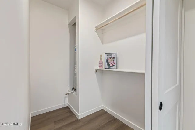 a view of an entryway with wooden floor