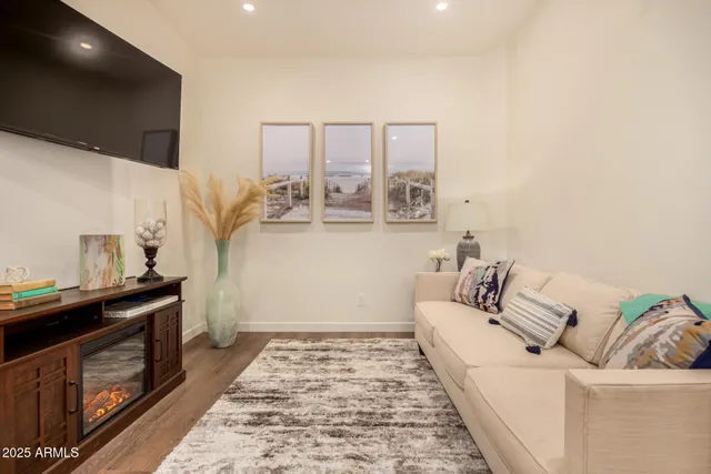 an aerial view of residential houses with outdoor space and parking
