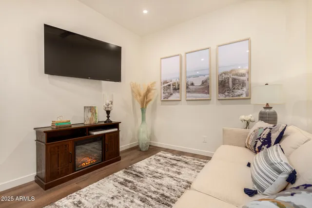 a living room with furniture and a fireplace
