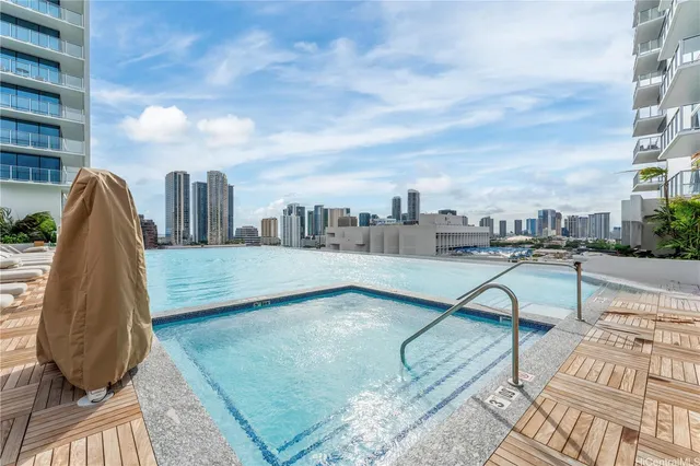 a view of swimming pool with lounge chair