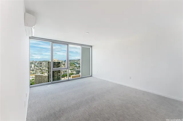 a view of an empty room with a window