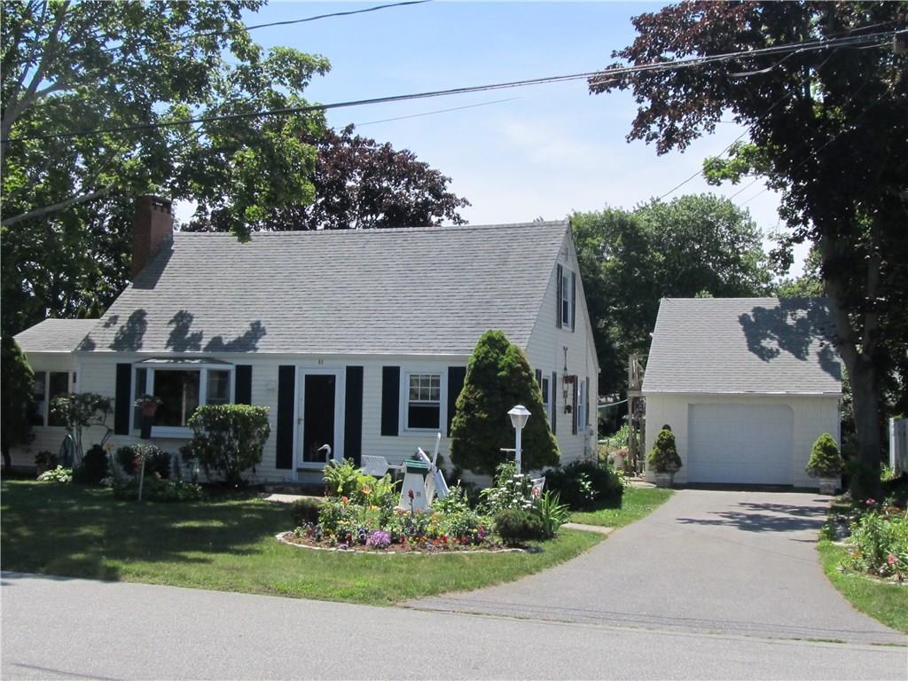 48 Whitecap Road East Lyme, CT 06357 - Photo 1 of 1 a front view of a house with a garden and plants