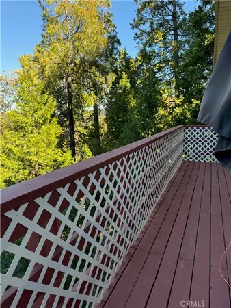 a view of balcony with wooden floor