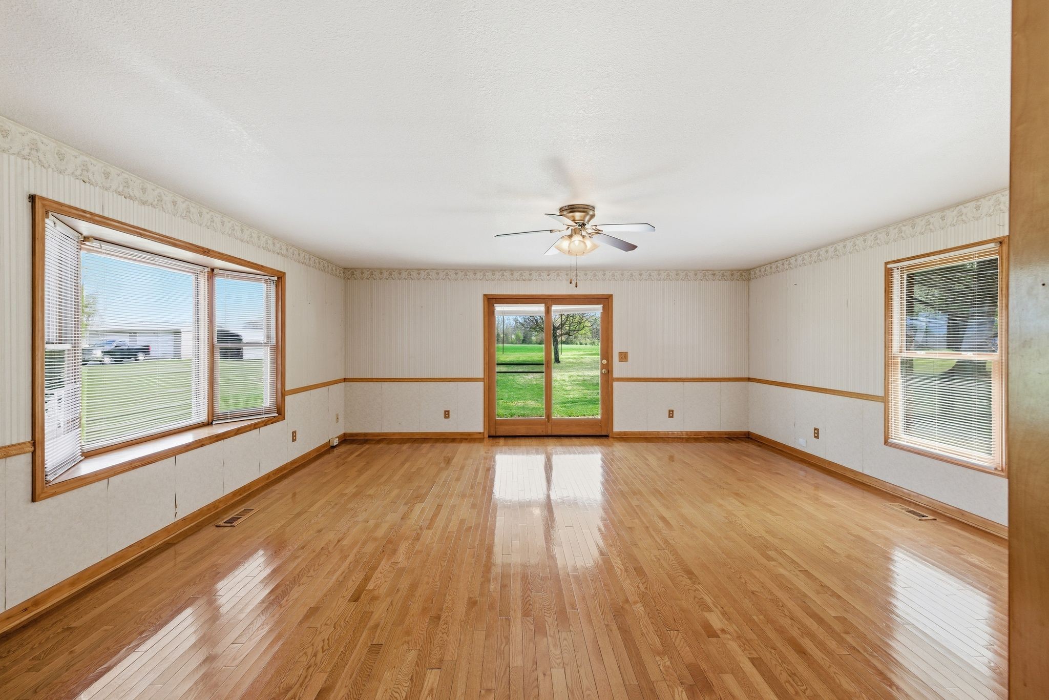 1956 Old Estill Springs Road Winchester, TN 37398 - Photo 5 of 30 a view of an empty room with wooden floor and a window