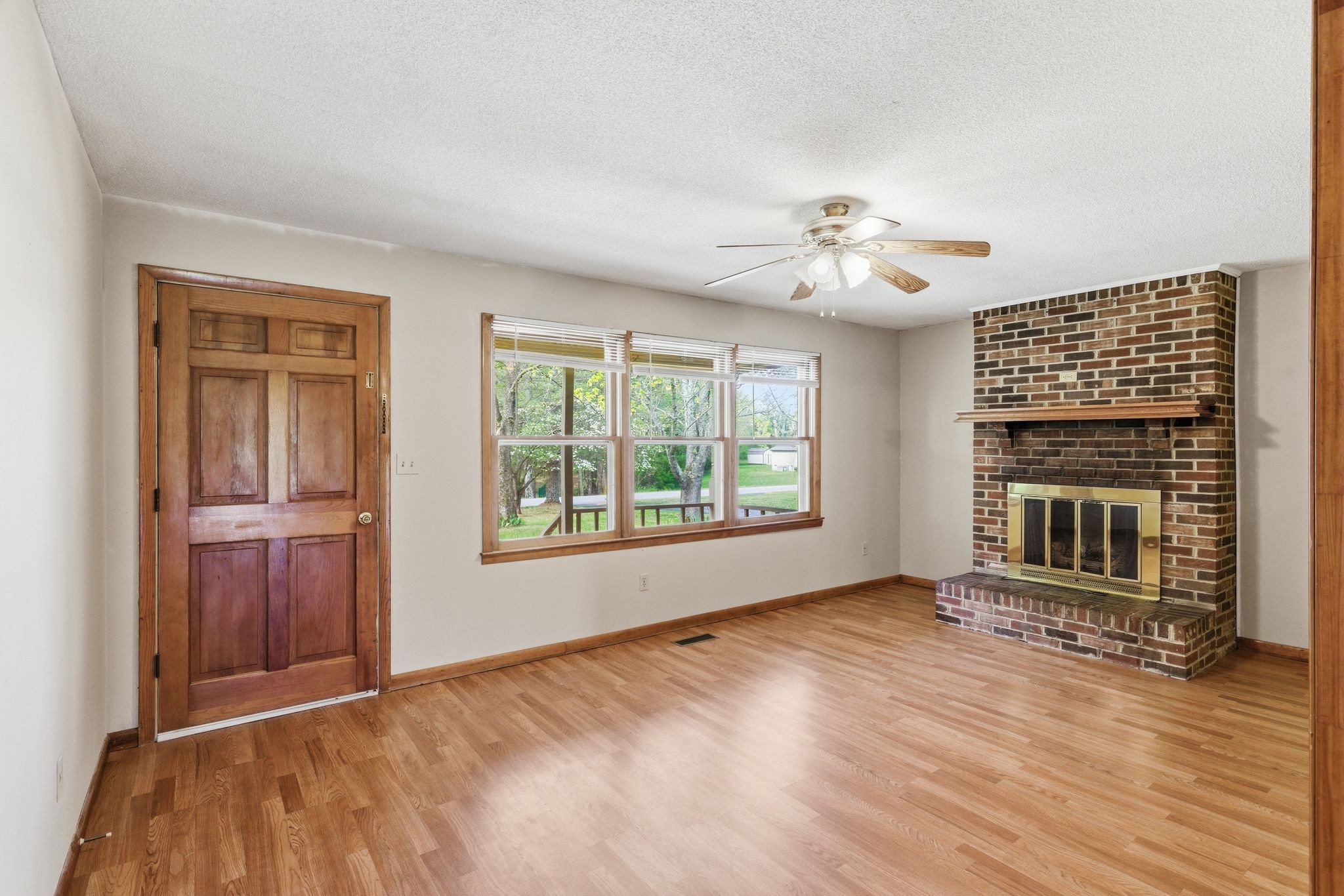 1956 Old Estill Springs Road Winchester, TN 37398 - Photo 7 of 30 a view of an empty room with a window and fireplace