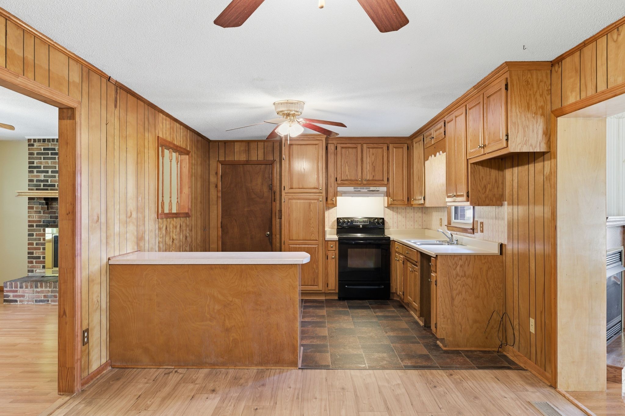 1956 Old Estill Springs Road Winchester, TN 37398 - Photo 8 of 30 a kitchen with a refrigerator a stove top oven a sink and dishwasher